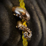 Bronze Octopus Arm Tassel Pin